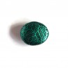 Black painted false pebble with metallic emerald green doodles magnet
